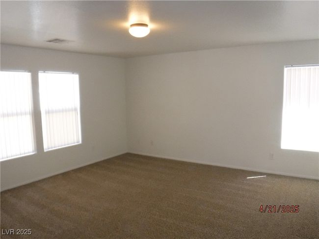 Master bedroom with a wealth of natural light and carpet | Image 14