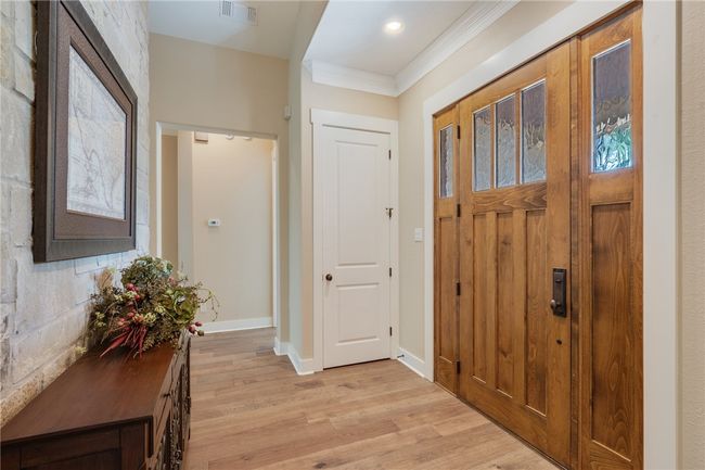 Entrance foyer featuring light wood-style flooring, ornamental molding, and baseboards | Image 16