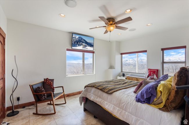 Bedroom featuring recessed lighting, baseboards, and multiple windows | Image 9
