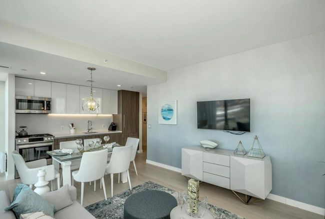 Living room with light wood-type flooring and recessed lighting | Image 4