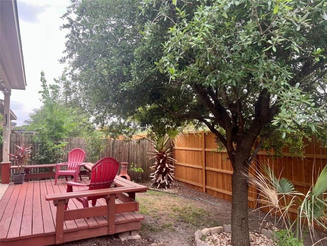 Fenced backyard with a deck | Image 16