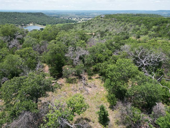 Birds eye view of property with a water view and a view of trees | Image 5