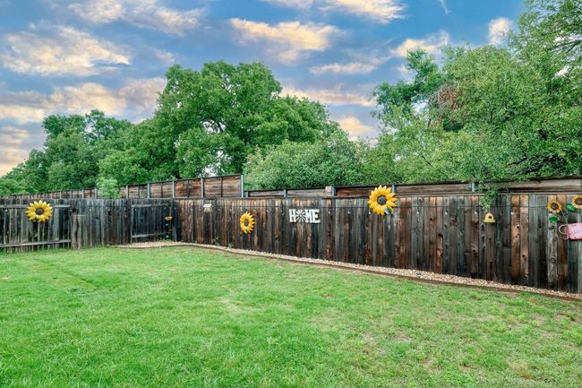This home backs up to a larger lot with an abundance of trees for ultimate privacy. | Image 23