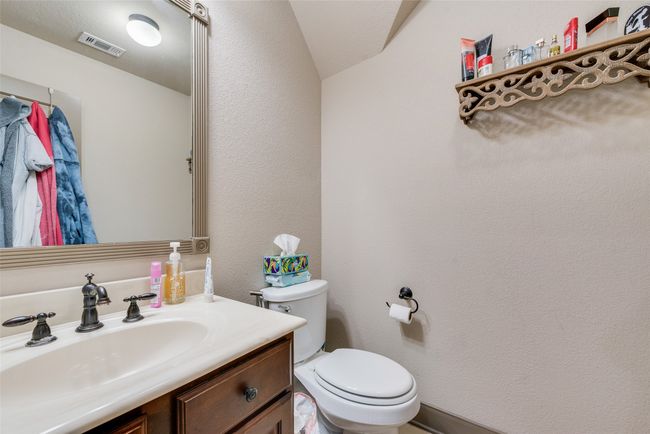 Bathroom featuring vanity and vaulted ceiling | Image 33