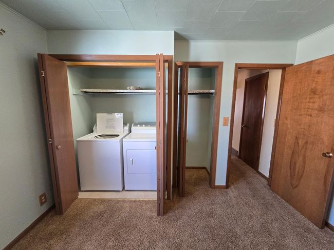 East bedroom laundry & closet | Image 20