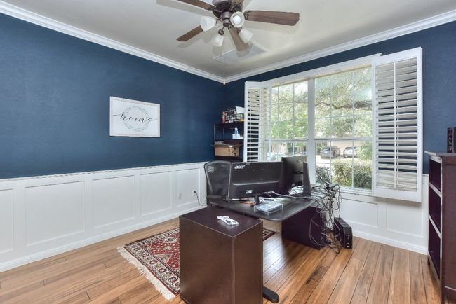 This inviting study/home office sits on the right side of the entry. | Image 5