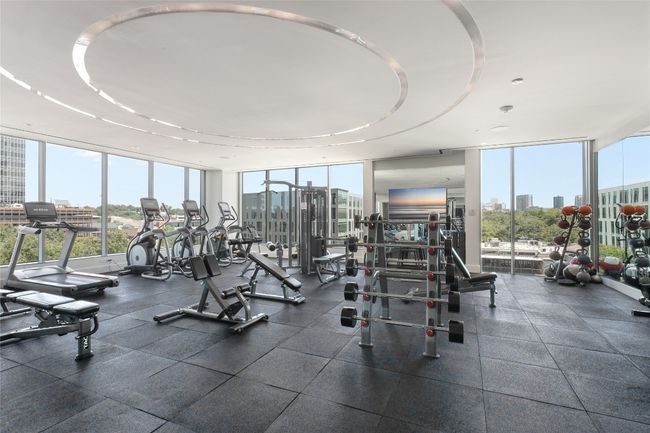 Gym with a view of skyline and a wall of windows | Image 31