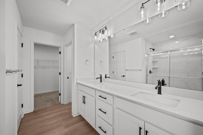 Owner's bathroom with comfort height vanity and double sinks. | Image 9