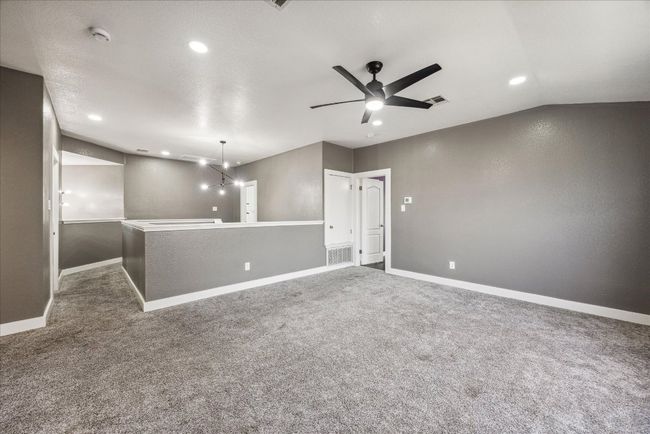 Unfurnished room featuring baseboards, carpet flooring, and visible vents | Image 20