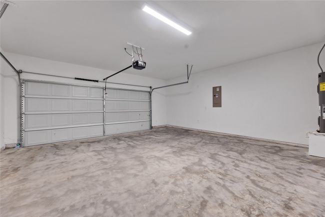 Garage with a garage door opener and electric panel | Image 28