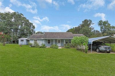 Welcome to 231 Isaac Ln. Three bedroom, two bath home on 1.79 acres per appraisal district. | Image 1