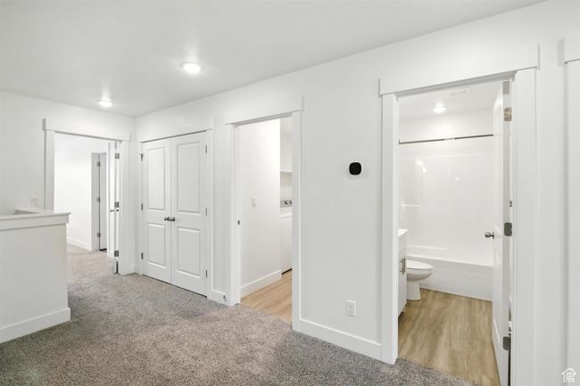 Hallway with carpet and recessed lighting | Image 10