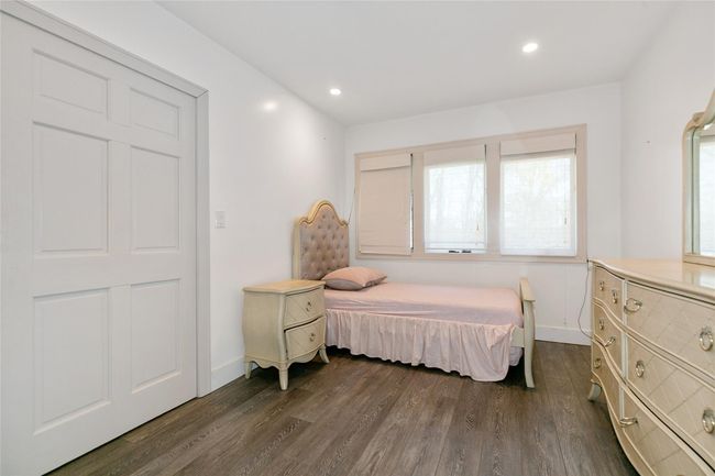 Bedroom featuring baseboards, recessed lighting, and dark wood-style flooring | Image 20