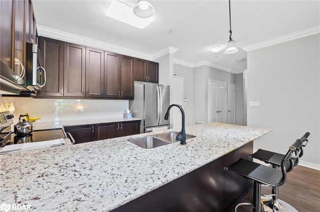 112 - 33 Whitmer St, House attached with 2 bedrooms, 2 bathrooms and 1 parking in Milton ON | Image 11