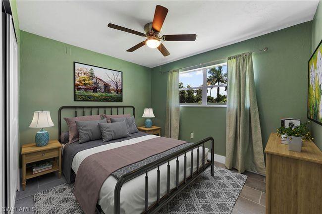Tiled bedroom featuring ceiling fan | Image 31