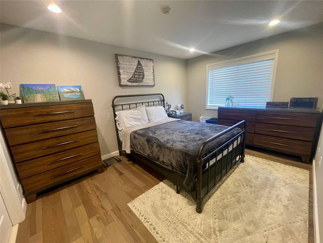 Bedroom featuring light wood-type flooring, and recessed lighting | Image 16