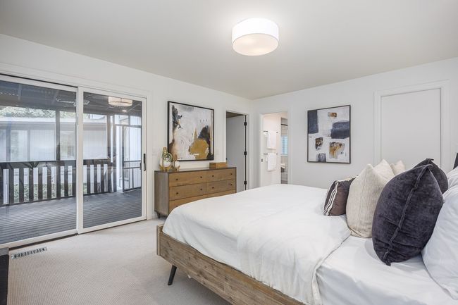 The primary bedroom is a serene escape. With ample closet space and an en suite bath make it both peaceful and practical—your personal haven in the heart of a truly special home. | Image 33