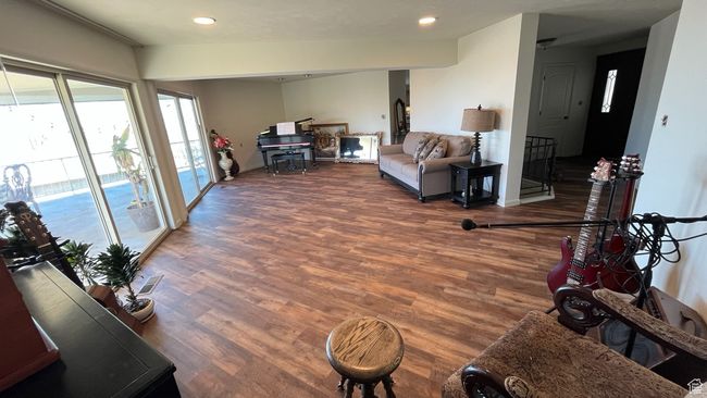 Living area with recessed lighting and wood finished floors | Image 13