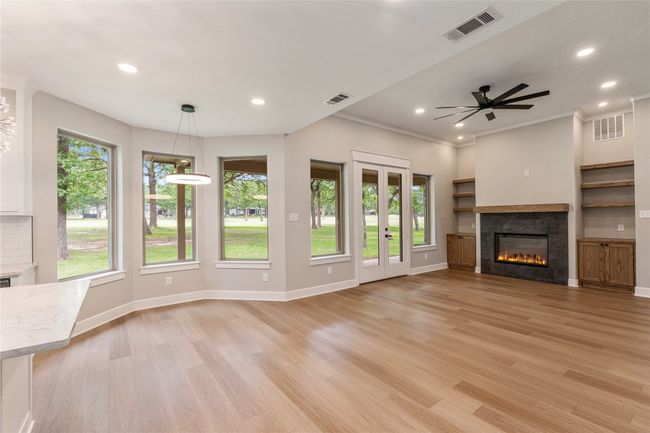 Wall of windows with tree lined views off fairway 17 | Image 7