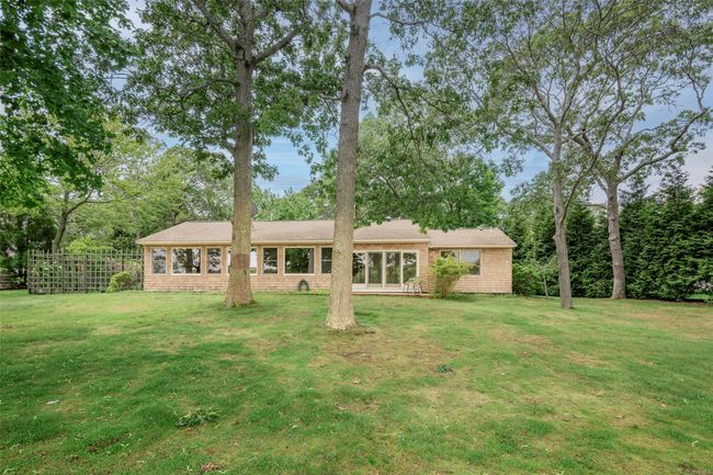Rear view of property featuring view of wooded area | Image 6