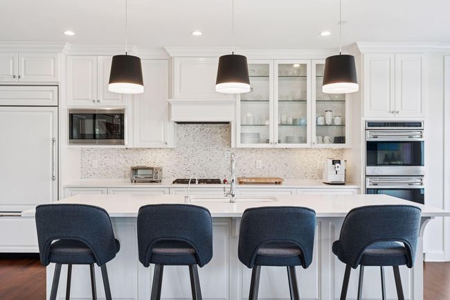 Center island is ideal for meal prep, entertaining, or grabbing a quick bite at the counter | Image 4