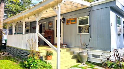 View of property exterior featuring a porch | Image 1