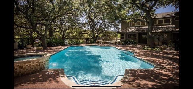 Pool surrounded by beautiful oak trees offering shade on a hot day. | Image 31