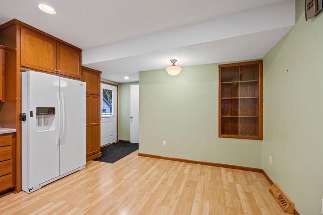 You can go directly from the kitchen out the back door to the deck for dining. | Image 5