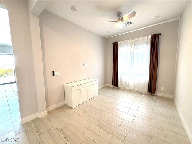 Spare room with a ceiling fan, visible vents, baseboards, and a healthy amount of sunlight | Image 18
