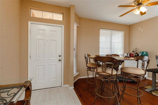 Foyer entrance featuring baseboards, ceiling fan, and light wood-style flooring | Image 5