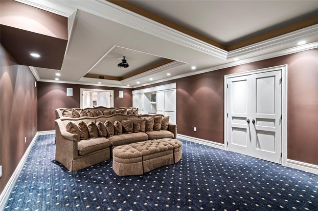 Workout room featuring hardwood / wood-style floors, ceiling fan, wood walls, and crown molding | Image 29