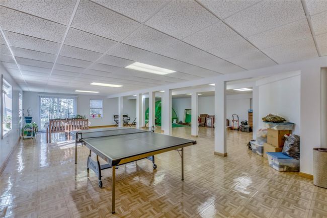 Playroom with light parquet flooring and a drop ceiling | Image 20