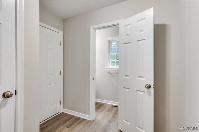 Entryway with light wood-style flooring and baseboards | Image 13