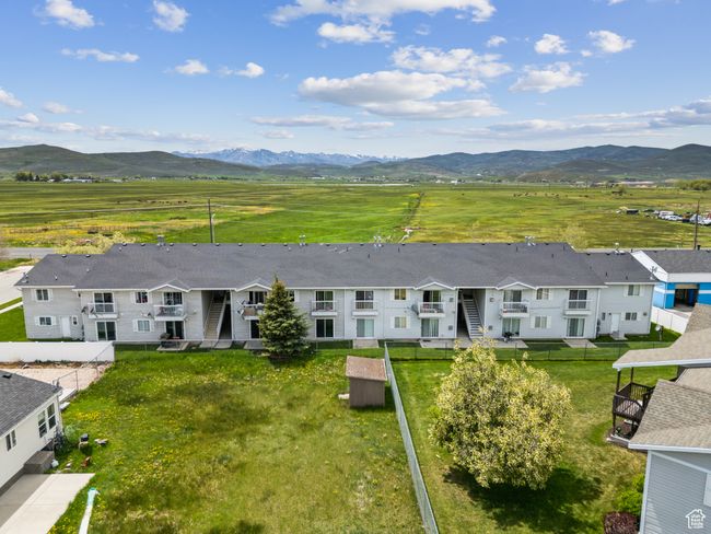 View of rural area with a mountainous background and nearby suburban area | Image 33