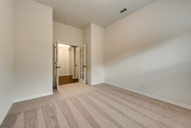 Unfurnished bedroom with carpet flooring and baseboards | Image 6