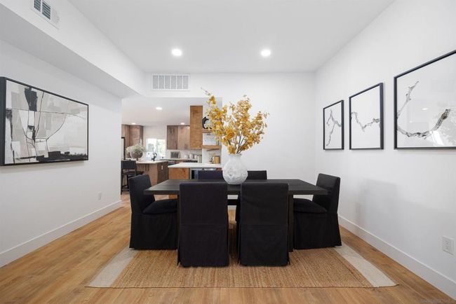 Formal dining area off the kitchen, beverage cooler at elbow of the kitchen | Image 24