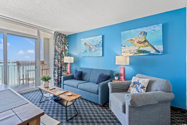 Living room featuring a textured ceiling and carpet | Image 15