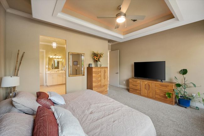 Primary bedroom looking in at luxury spa bath | Image 15