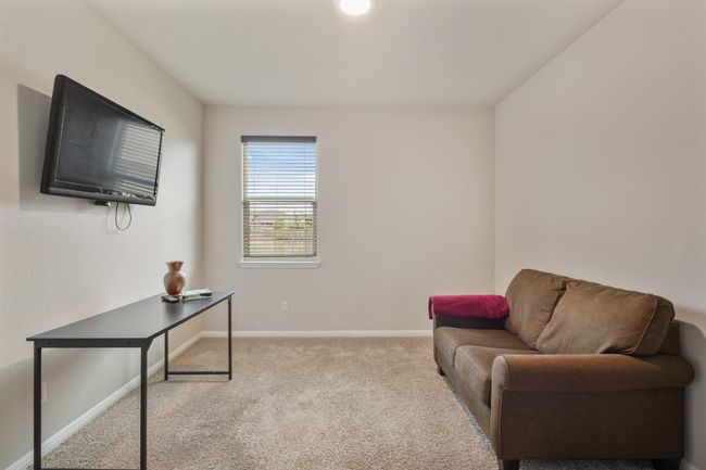 Living space/Bedroom 4 or office located in the center of the home. | Image 18