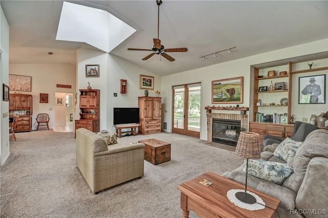 Wood burning fireplace in living room, opens to back porch | Image 10