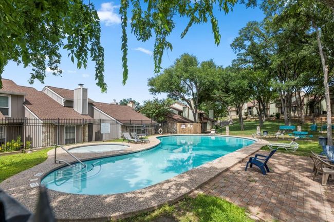 Community pool with a patio, a community hot tub, and a residential view | Image 25