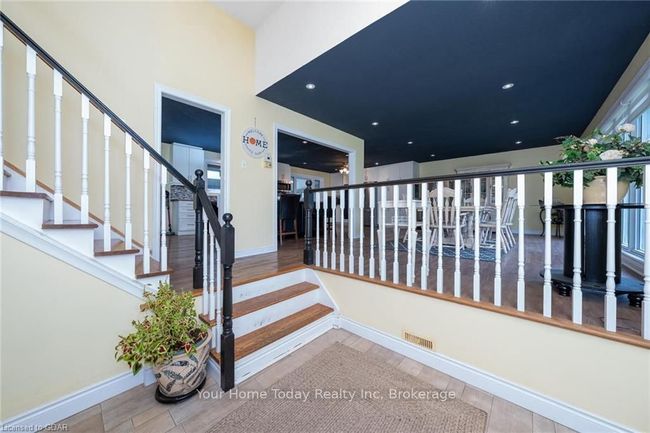 Stairway featuring hardwood / wood-style floors | Image 8