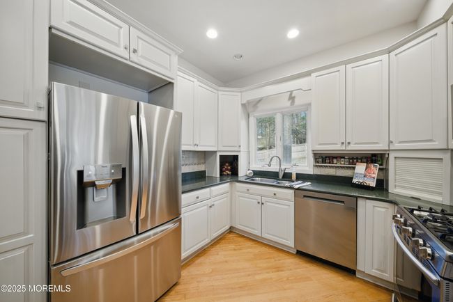 Eat in Kitchen with separate Dining, Coffee bar, SS appliances with sliders to LARGE deck with privacy and nature. | Image 7
