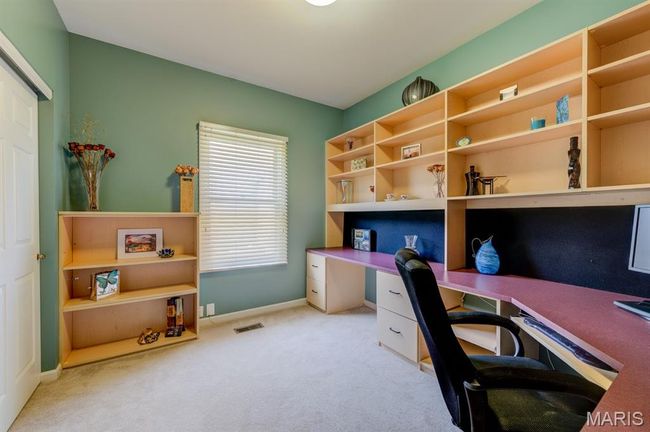 The third bedroom comes furnished with a built-in, custom desk for an amazing office space. | Image 26