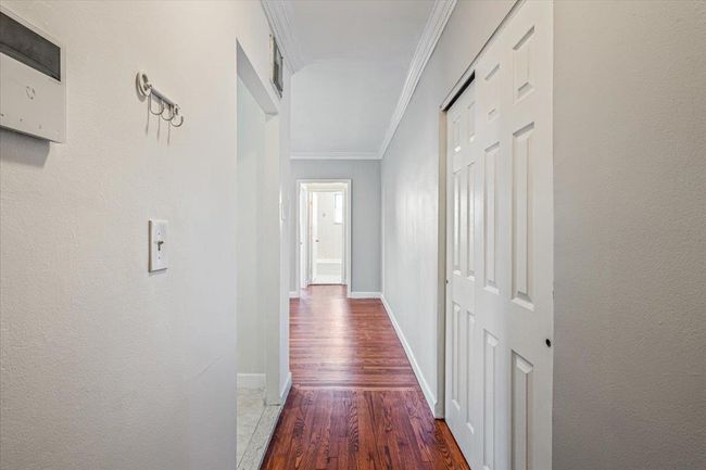 Hall featuring ornamental molding and hardwood / wood-style flooring | Image 8