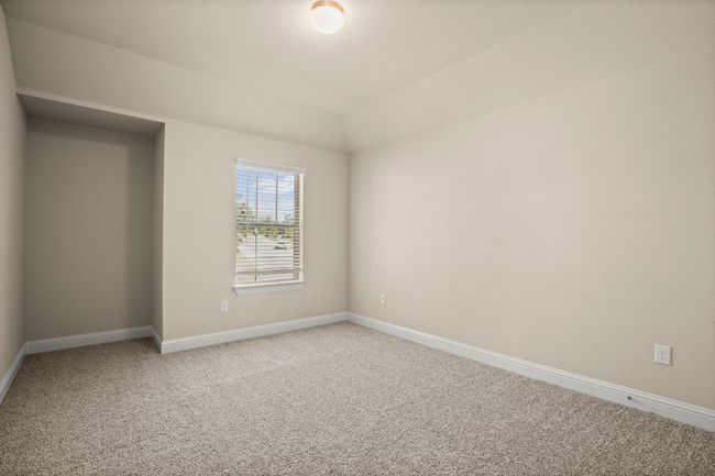 Unfurnished room featuring carpet, vaulted ceiling, and baseboards | Image 26
