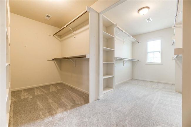 Spacious closet with carpet flooring | Image 29