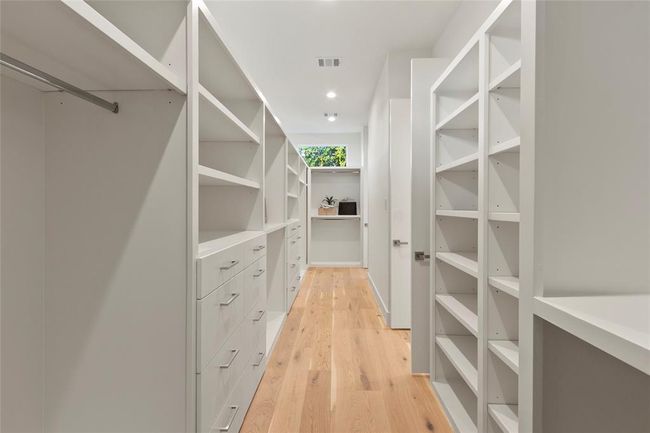 Huge primary custom bedroom closet with double entry | Image 17