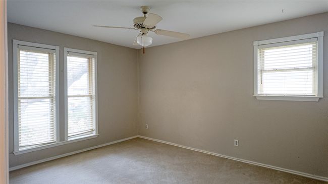 Empty room featuring baseboards, plenty of natural light, and light carpet | Image 33
