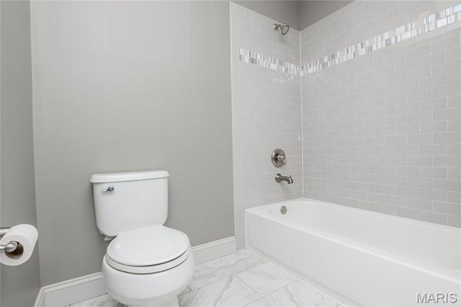 Upstairs hall full bath featuring toilet and shower / tub | Image 32
